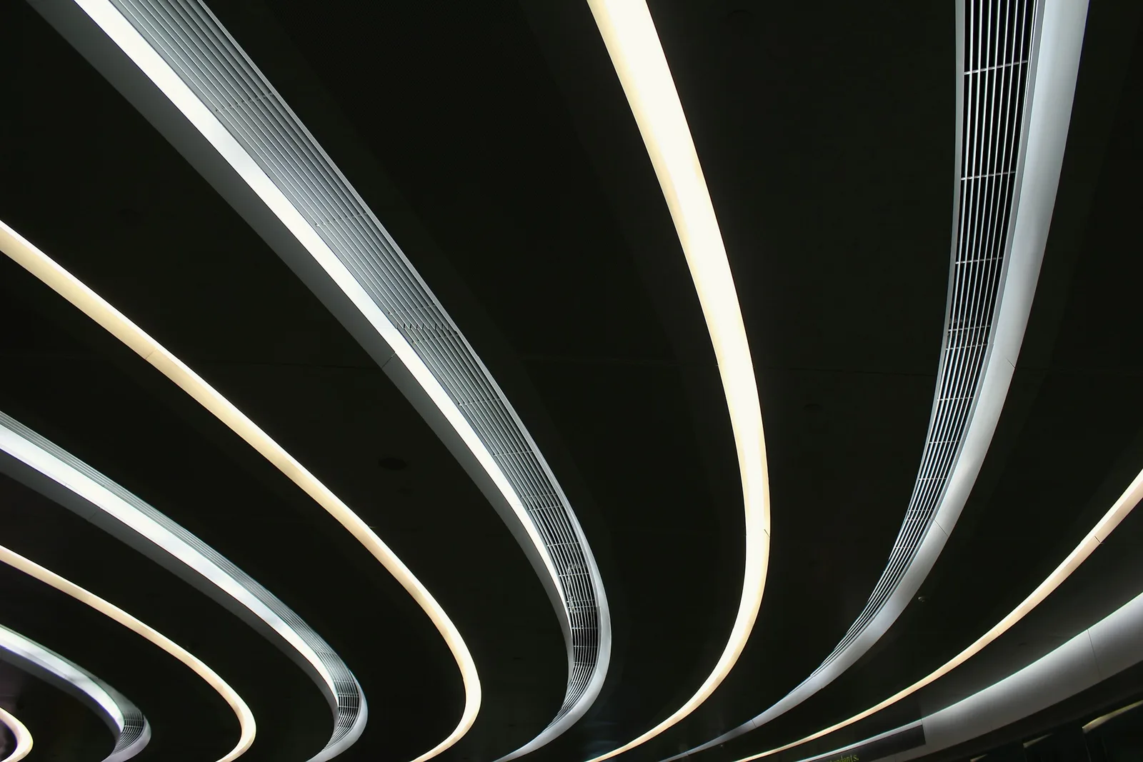 Parallel curved light channels sweeping out of darkness